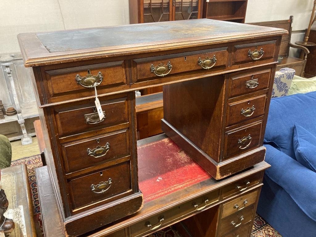 A late Victorian walnut kneehole desk, length 106cm, depth 60cm, height 74cm